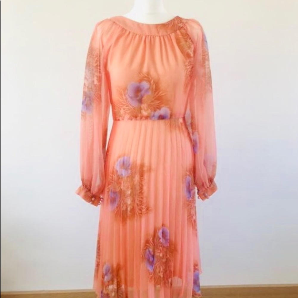 A floral pleated skirt long sleeve dress